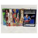 Lot of (8) NFL Game Used Football Cards