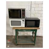 LOT OF 3 MICROWAVES AND WOOD TABLE