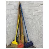 LARGE LOT OF BROOMS AND DUST PANS