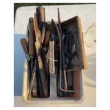 PLASTIC CARRIER WITH FILES, CHISELS, PRY BARS AND