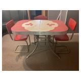 1950'S STEEL LEG TABLE WITH THREE CHAIRS
