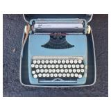 SMITH CORONA STERLING BLUE TYPEWRITER W/CARRY CASE