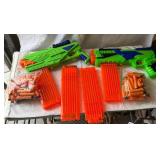 Green and Orange Toy Dart Blasters with...