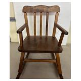 Small Wooden Rocking Chair with Slat Back Design
