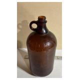 Brown Glass Jug Embossed with Purex Logo