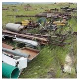 Field Assortment of Metal Pipe, Augers,