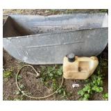 Metal Trough, Gasoline Can, and Hose