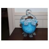 Blue art glass basket with ruffled edges and