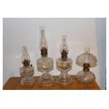 4 Miniature clear glass oil lamps
