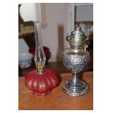 Cranberry satin glass oil lamp and an oil lamp