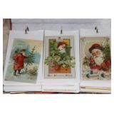 Old Christmas themed postcards in a binder some