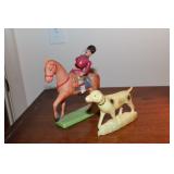 Celluloid soldier with moveable arms on horse