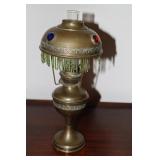 Small Art Nouveau brass oil lamp with raised