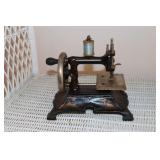 Muller cast iron toy sewing machine marked made