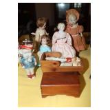 Lot of bisque dolls, wooden cradle and a