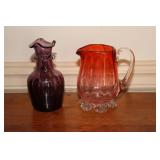 Cranberry flash glass creamer and an art glass