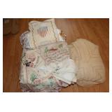 Lot of linens including afghans, pillow cases,