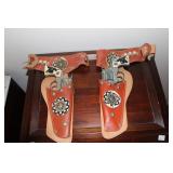 2 Hubley Western toy cap guns with double holster