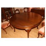 Cherry round dining table with 6 intricately