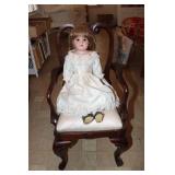 Florodora porcelain doll with a mahogany arm