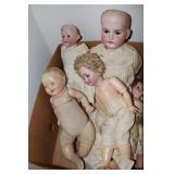 Box of antique dolls including Petite Amer.