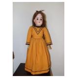 Doll with jointed arms and legs marked  K and C