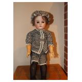 Doll with porcelain face and jointed arms and