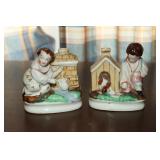 2 Porcelain figurines/pen holders - 1 is a boy