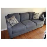 Ashley Furniture blue couch with accent pillows