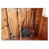 Corner Lot including rakes, axes, shovels, bar