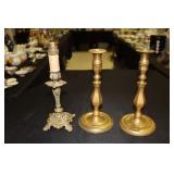 Pair of brass candlesticks and a brass lamp base