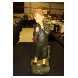 Plaster statue of young boy