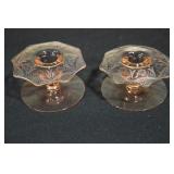 Pair of pink depression glass candlesticks with