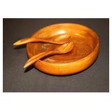 Wooden salad bowl with utensils