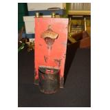 Coca Cola bottle opener with bottle top catcher