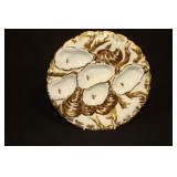 Gold trimmed oyster plate marked New York on