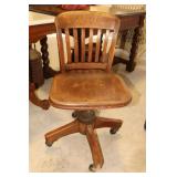 Oak rolling desk chair with Carl A Braun 164