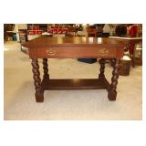Carved oak writing table with barley twist