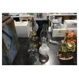 2 oil lamps 1 finger lamp and  2 chimneys