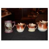 3 Moose pitchers (1 small one has chips) and an