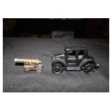 Cast iron Ford Model T toy car and a brass Fort