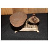 Small cast iron balance scale with weights