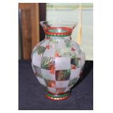 Holly decorated vase with candle