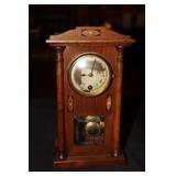 Small antique mantel clock in oak case (ran when