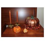 Pumpkin decorations and a pair of chambersticks