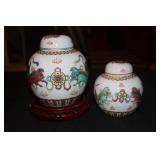 2 Chinese ginger jars decorated with foo dogs -