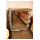 Framed beveled glass wall mirror (has mark on