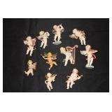 10 Small cherub figurines some marked Italy,