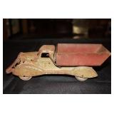 Pressed steel dump truck with wooden wheels