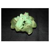 Porcelain frogs on a lily pad figurine